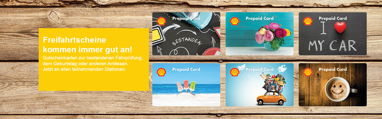 Die neuen Glückwunschkarten der Shell Prepaid Card auf Holzhintergrund